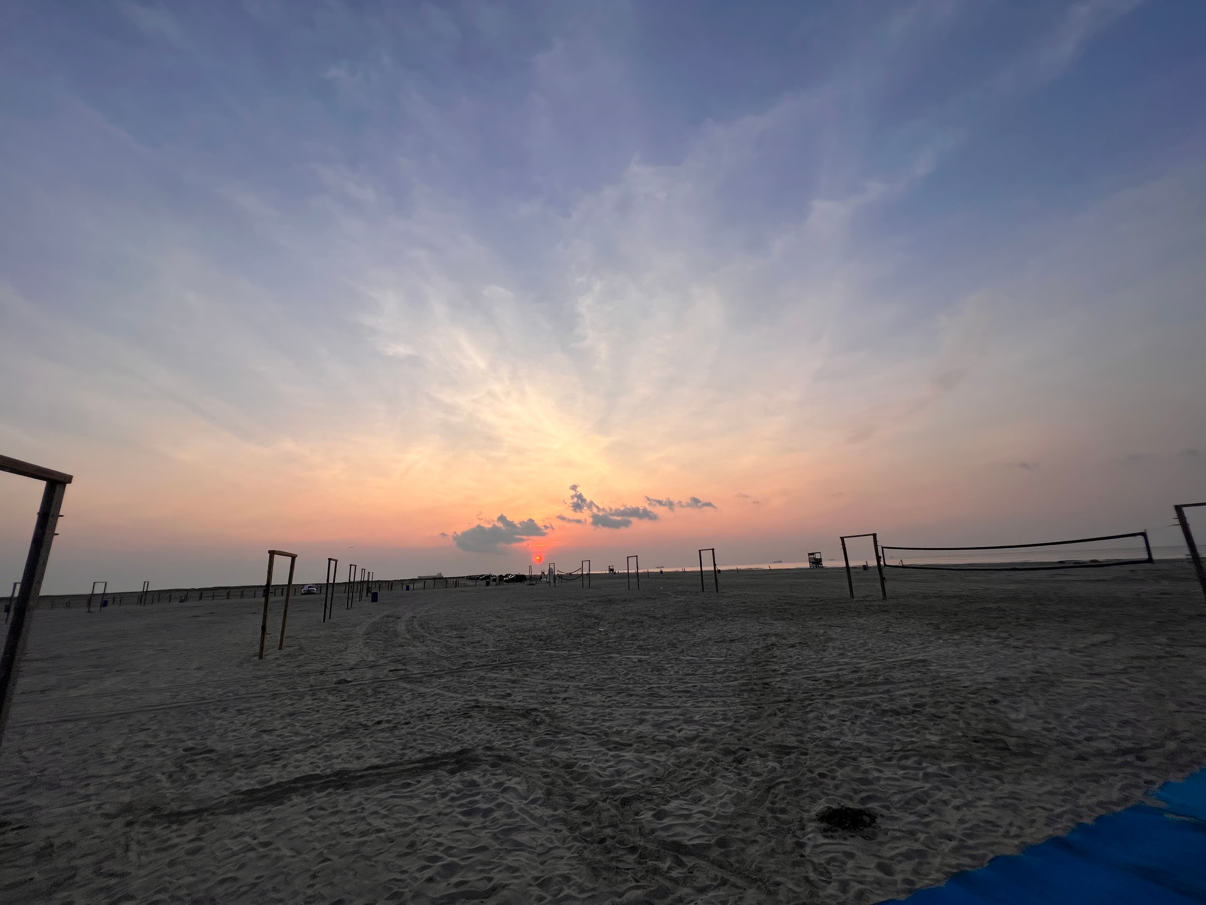 Beach volleyball courts at sunset